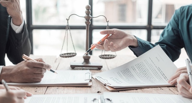 legal_agreements_opt_shutterstock Legal agreements with scales of justice in background
