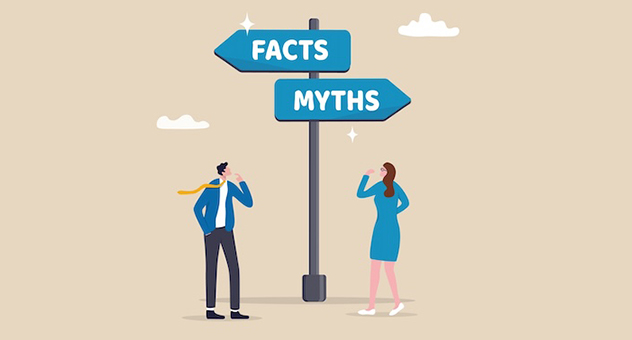 Two people looking up at signposts labelled facts and myths that are pointing in opposite directions