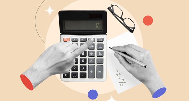 PXL_20230507_142535864 hands type in calculator and make notes on paper