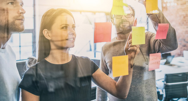 colleagues-plan-with-sticky-notes