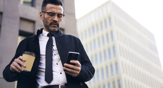 man-on-phone-with-coffee