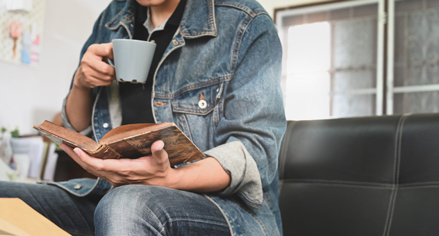 man-with-coffee-and-book
