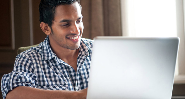 smiling-man-at-laptop