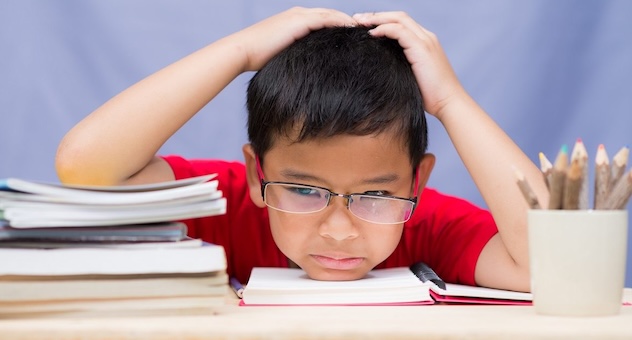 PXL_20230507_142535864 Unhappy schoolboy reading difficult homework