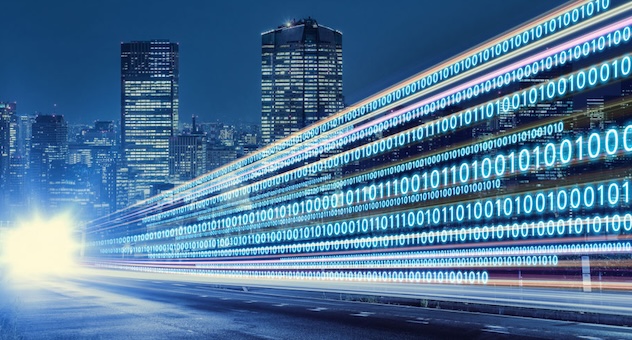 digital_data_city_featured Shining binary data superimposed over nighttime cityscape